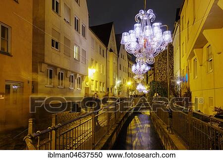 Stock Image - Night of 1000 lights, chandelier over Mittlerem Lech, Lechviertel, Augsburg, Swabia, Bavaria, Germany, Europe. Fotosearch
