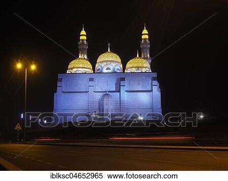 Stock Photography - Night view of the Mohammed Al Ameen Mosque with minaret, illuminated, Muscat, Oman, Asia. Fotosearch