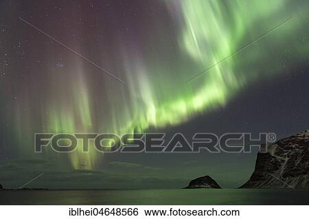 Stock Photograph - Northern lights on the coast near Gimsoy, Lofoten, Norway, Europe. Fotosearch