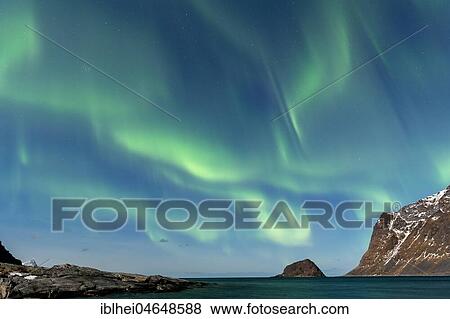 Stock Photo - Northern lights on the coast of Haukland, Lofoten, Norway, Europe. Fotosearch