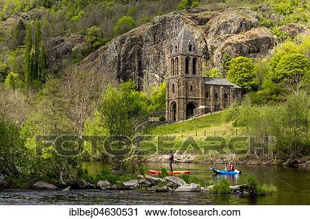 Stock Image - Notre Dame des Chazes church on the River Allier with canoeists, Haute Loire departement, Auvergne, France, Europe. Fotosearch