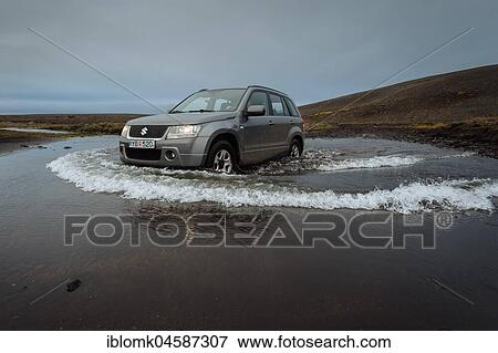 Off road vehicle drives through waterfurt, Sprengisandur highland road, Iceland, Europe View Large Photo Image Stock Photo - Off road vehicle drives through waterfurt, Sprengisandur highland road, Iceland, Europe. Fotosearch