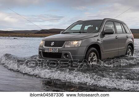 Off road vehicle drives through waterfurt, Sprengisandur highland road, Iceland, Europe View Large Photo Image Stock Photograph - Off road vehicle drives through waterfurt, Sprengisandur highland road, Iceland, Europe. Fotosearch