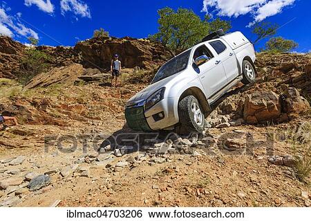 Off-road vehicle in the van Zyls Pass, Kunene region, Namibia, Africa View Large Photo Image Stock Photograph - Off-road vehicle in the van Zyls Pass, Kunene region, Namibia, Africa. Fotosearch