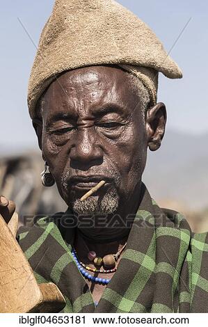 Stock Image - Old man, going blind, Arbore tribe, portrait, Turmi, Ethiopia, Africa. Fotosearch
