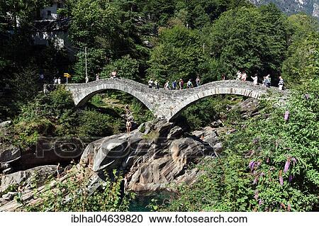 Stock Image - Old Roman bridge Ponte dei Salti over Verzasca, Lavertezzo, Verzascatal, Valle Verzasca, Canton Ticino, Switzerland, Europe. Fotosearch
