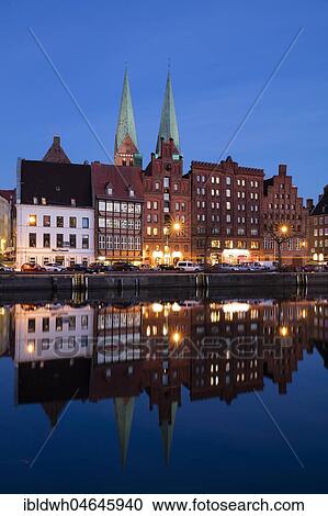 Old town at Stadttrave, Untertrave, with church St. Marien, twilight, blue hour, Lübeck, Schleswig-Holstein, Germany, Europe View Large Photo Image Stock Image - Old town at Stadttrave, Untertrave, with church St. Marien, twilight, blue hour, Lübeck, Schleswig-Holstein, Germany, Europe. Fotosearch