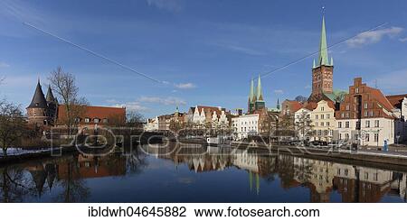 Stock Image - Old town on Obertrave, Holstentor, Church of St. Marien, Church of St. Petri, Lübeck, Schleswig-Holstein, Germany, Europe. Fotosearch