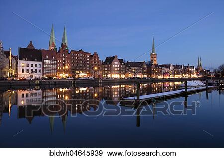 Old town on the Stadttrave, Untertrave, with churches St. Marien, St. Petri and cathedral, twilight, blue hour, Lübeck, Schleswig-Holstein, Germany, Europe View Large Photo Image Stock Photo - Old town on the Stadttrave, Untertrave, with churches St. Marien, St. Petri and cathedral, twilight, blue hour, Lübeck, Schleswig-Holstein, Germany, Europe. Fotosearch