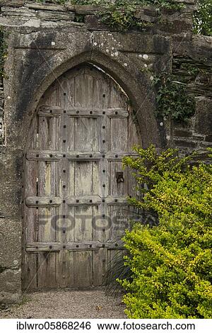 Old wooden door in the gardens of Victorian manor house Lanhydrock House, National Trust, Bodmin, Cornwall, United Kingdom, Europe View Large Photo Image Stock Photograph - Old wooden door in the gardens of Victorian manor house Lanhydrock House, National Trust, Bodmin, Cornwall, United Kingdom, Europe. Fotosearch