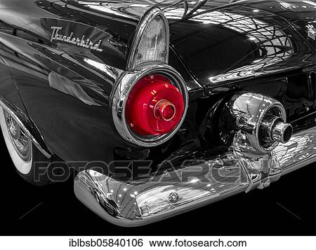 Oldtimer detail, Ford Thunderbird 1955, in black and white, with red brake light View Large Photo Image Stock Photograph - Oldtimer detail, Ford Thunderbird 1955, in black and white, with red brake light. Fotosearch