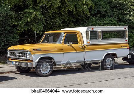 Picture - Oldtimer Ford F100 Styleside Sport Custom pickup truck with camping body, motorhome, built 1971, Bavaria, Germany, Europe. Fotosearch