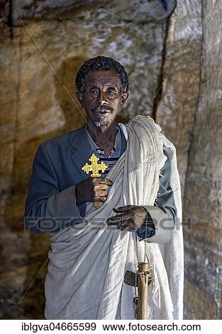 Orthodox priest inside the rock church Medhane Alem, Tigray Province, Ethiopia, Africa View Large Photo Image Stock Photo - Orthodox priest inside the rock church Medhane Alem, Tigray Province, Ethiopia, Africa. Fotosearch