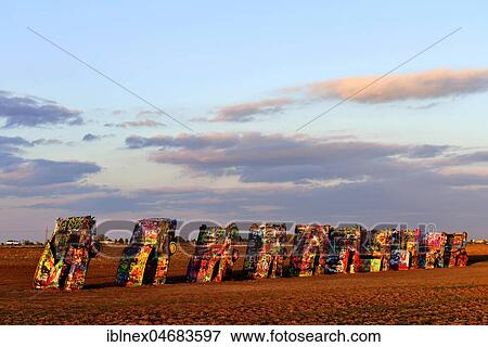 Stock Photo - Painted floor-rammed Cadillacs, public art installation Cadillac Ranch, artist Stanley Marsh 3, Route 66, Amarillo, Texas, USA, North America. Fotosearch