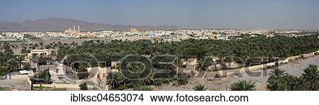 Palm oasis, in the back Nakhl with mosque, view from the fortress Nakhl, panorama, Oman, Asia View Large Photo Image Picture - Palm oasis, in the back Nakhl with mosque, view from the fortress Nakhl, panorama, Oman, Asia. Fotosearch