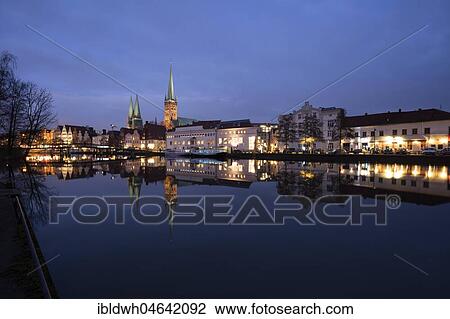 Panorama at the Obertrave, twilight, Old Town, Church of St. Marien, Church of St. Petri, Hanseatic City of Lübeck, Schleswig-Holstein, Germany, Europe View Large Photo Image Stock Image - Panorama at the Obertrave, twilight, Old Town, Church of St. Marien, Church of St. Petri, Hanseatic City of Lübeck, Schleswig-Holstein, Germany, Europe. Fotosearch