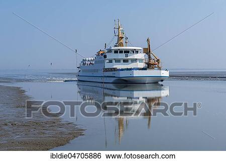 Passenger ferry Baltrum I, tidal creek, Neßmersiel, East Frisia, Lower Saxony, Germany, Europe View Large Photo Image Stock Photograph - Passenger ferry Baltrum I, tidal creek, Neßmersiel, East Frisia, Lower Saxony, Germany, Europe. Fotosearch