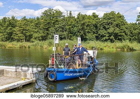 Passenger ferry in Stolpe an der Peene, Peene River Valley nature park Park, Mecklenburg-Vorpommern, Germany, Europe View Large Photo Image Stock Photo - Passenger ferry in Stolpe an der Peene, Peene River Valley nature park Park, Mecklenburg-Vorpommern, Germany, Europe. Fotosearch