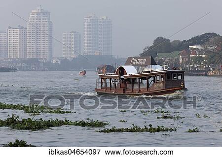 Passenger ferry of the Hotel Chatrium Riverside on the Mae Nam Chao Phraya River, Sathon, Bangkok, Thailand, Asia View Large Photo Image Stock Photo - Passenger ferry of the Hotel Chatrium Riverside on the Mae Nam Chao Phraya River, Sathon, Bangkok, Thailand, Asia. Fotosearch