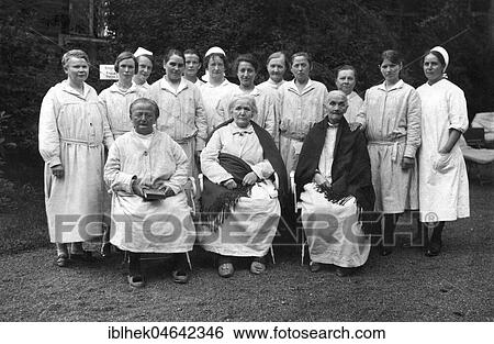 Stock Photograph - Patients with nurses in the garden, 1930s, Germany, Europe. Fotosearch