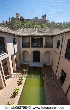 Stock Image - Patio, Casa de Zafra, old Moorish house with inner courtyard and well, Granada, Andalusia, Spain, Europe. Fotosearch