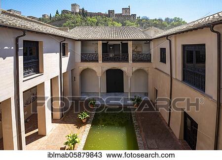 Stock Image - Patio, Casa de Zafra, old Moorish house with inner courtyard and well, Granada, Andalusia, Spain, Europe. Fotosearch