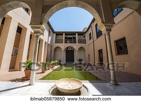 Stock Image - Patio, Casa de Zafra, old Moorish house with inner courtyard and well, Granada, Andalusia, Spain, Europe. Fotosearch