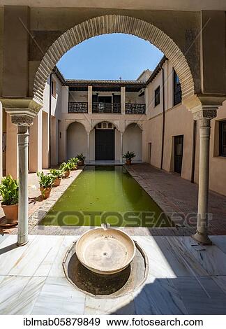 Stock Photo - Patio, Casa de Zafra, old Moorish house with inner courtyard and well, Granada, Andalusia, Spain, Europe. Fotosearch