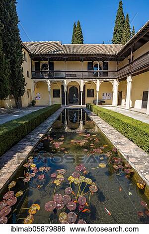 Stock Photograph - Patio with fountain, Casa del Chapiz, Escuela de Estudios Árabes, old Moorish house, Granada, Andalusia, Spain, Europe. Fotosearch
