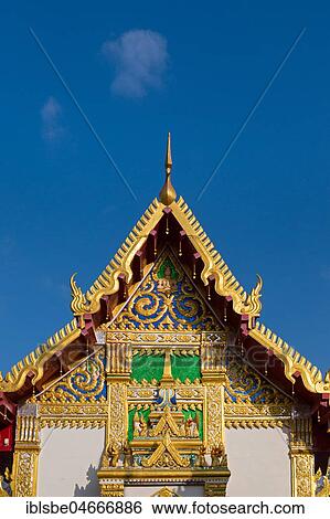 Pediment of the Bot in front of the Chedi of Wat Phra That Phanom, temple complex in Amphoe That Phanom, Nakhon Phanom Province, Isan, Thailand, Asia View Large Photo Image Stock Photograph - Pediment of the Bot in front of the Chedi of Wat Phra That Phanom, temple complex in Amphoe That Phanom, Nakhon Phanom Province, Isan, Thailand, Asia. Fotosearch