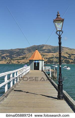 Picture - Pier in the bay of Akaroa, Oceania, Banks Peninsula, Canterbury, South Island, New Zealand, Oceania. Fotosearch