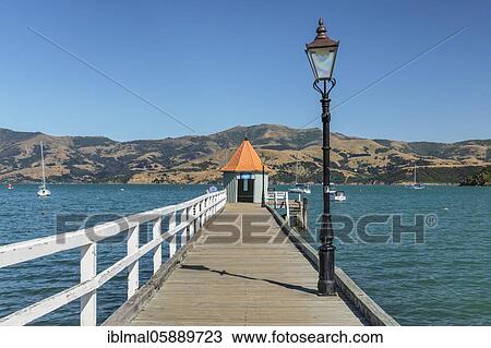 Pier in the bay of Akaroa, Oceania, Banks Peninsula, Canterbury, South Island, New Zealand, Oceania View Large Photo Image Stock Image - Pier in the bay of Akaroa, Oceania, Banks Peninsula, Canterbury, South Island, New Zealand, Oceania. Fotosearch