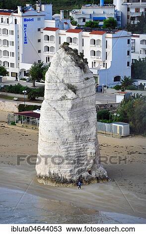 Stock Image - Pizzomunno, limestone cliffs on the beach, landmark of Vieste, Gargano, Foggia Province, Apulia, Italy, Europe. Fotosearch