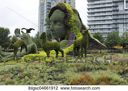 Plant sculpture Mother Earth with modern buildings behind, Mosaicanada Exhibition, Gatineau, Quebec Province, Canada, North America View Large Photo Image Stock Image - Plant sculpture Mother Earth with modern buildings behind, Mosaicanada Exhibition, Gatineau, Quebec Province, Canada, North America. Fotosearch