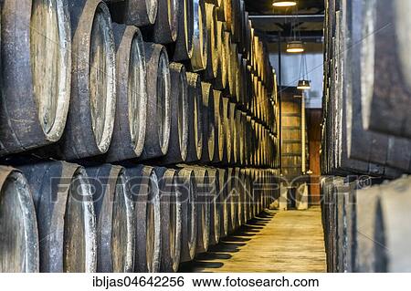 Stock Photograph - Plenty of port wine barrels in a wine cellar in Vila Nova de Gaia, Portugal, Europe. Fotosearch