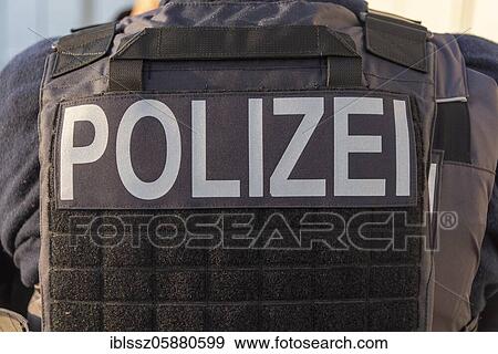 Stock Photo - Police lettering, bulletproof vest, Magdeburg, Saxony-Anhalt, Germany, Europe. Fotosearch