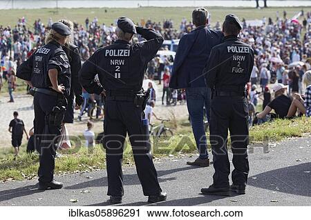 Stock Image - Police monitors demonstration against corona rules on the Rhine meadows, Düsseldorf, North Rhine-Westphalia, Germany, Europe. Fotosearch