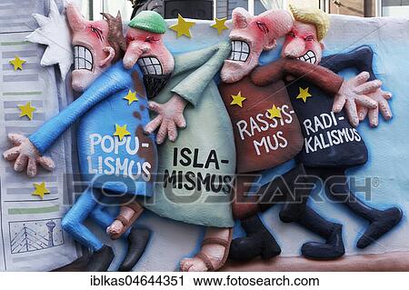 Populism, Islamism, racism, and radicalism personified running against the wall, political caricature, motto caravan during Carnival Monday procession 2018, Düsseldorf, North Rhine-Westphalia, Germany, Europe View Large Photo Image Stock Image - Populism, Islamism, racism, and radicalism personified running against the wall, political caricature, motto caravan during Carnival Monday procession 2018, Düsseldorf, North Rhine-Westphalia, Germany, Europe. Fotosearch