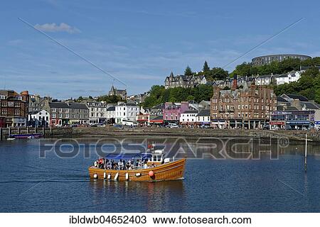 Stock Image - Port and city centre with McCaig's Tower, Oban, Argyll and Bute, Scotland, Great Britain. Fotosearch