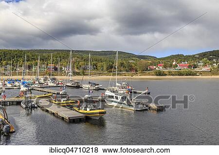Port of Tadoussac, behind Hotel Tadoussac at the mouth of the Saguenay Fjord into the St. Lawrence Current, Tadoussac, Québec Province, Canada, North America View Large Photo Image Stock Photo - Port of Tadoussac, behind Hotel Tadoussac at the mouth of the Saguenay Fjord into the St. Lawrence Current, Tadoussac, Québec Province, Canada, North America. Fotosearch