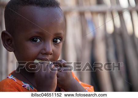 Portrait of a little boy, eating, Ethiopia, Africa View Large Photo Image Stock Image - Portrait of a little boy, eating, Ethiopia, Africa. Fotosearch