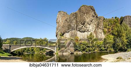 Stock Image - Prades village, the volcanic basalt formation of Roche Serviere, Haute-Loire department, Auvergne-Rhône-Alpes, France, Europe. Fotosearch