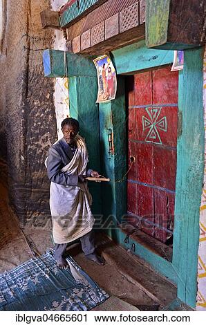 Priest at the door to the rock church Medhane Alem of Adi Kasho, Tigray Province, Ethiopia, Africa View Large Photo Image Stock Image - Priest at the door to the rock church Medhane Alem of Adi Kasho, Tigray Province, Ethiopia, Africa. Fotosearch