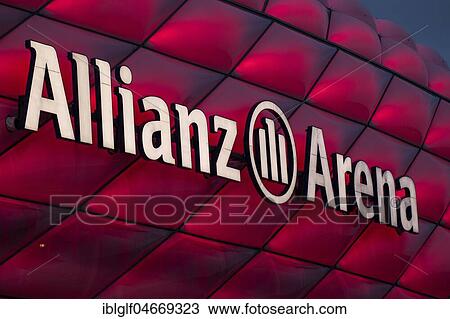 Stock Image - Red illuminated Allianz Arena with lettering, detail, Munich, Upper Bavaria, Bavaria, Germany, Europe. Fotosearch