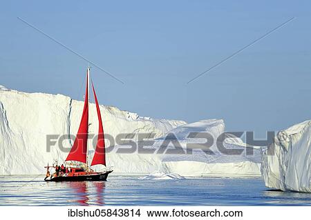 Red sailing boat in front of gigantic icebergs, Icefjord, UNESCO World Heritage Site, Disko Bay, Ilulissat, West Greenland, Greenland, North America View Large Photo Image Picture - Red sailing boat in front of gigantic icebergs, Icefjord, UNESCO World Heritage Site, Disko Bay, Ilulissat, West Greenland, Greenland, North America. Fotosearch