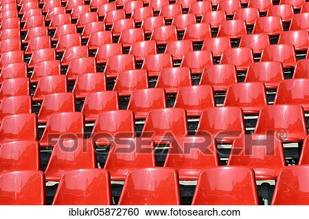 Stock Image - Red seat shells in the Rhein Energie Stadium, Cologne, Germany, Europe. Fotosearch