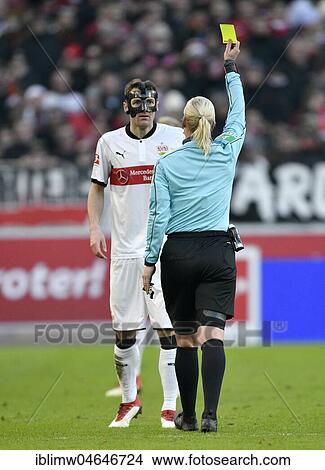 Referee Bibiana Steinhaus shows Christian Gentner of VfB Stuttgart with face mask the yellow card, Mercedes-Benz Arena, Stuttgart, Baden-Württemberg, Germany, Europe View Large Photo Image Picture - Referee Bibiana Steinhaus shows Christian Gentner of VfB Stuttgart with face mask the yellow card, Mercedes-Benz Arena, Stuttgart, Baden-Württemberg, Germany, Europe. Fotosearch