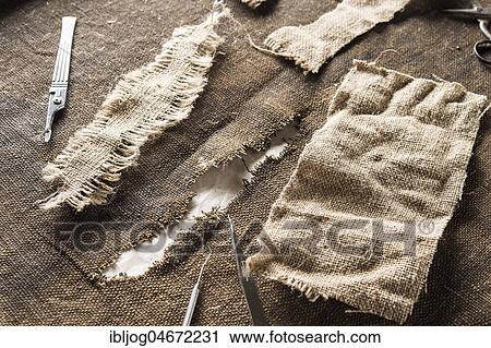 Restoration atelier, crack in fasting cloth, restored with linen patches and tools, Munich, Bavaria, Germany, Europe View Large Photo Image Stock Image - Restoration atelier, crack in fasting cloth, restored with linen patches and tools, Munich, Bavaria, Germany, Europe. Fotosearch