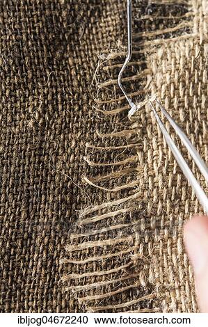 Restoration studio, restorer, hands fixing a linen patch with thread bridge with tools and glue over a crack in a lent scarf, Munich, Bavaria, Germany, Europe View Large Photo Image Stock Image - Restoration studio, restorer, hands fixing a linen patch with thread bridge with tools and glue over a crack in a lent scarf, Munich, Bavaria, Germany, Europe. Fotosearch
