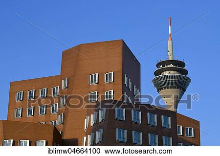 Stock Image - Rhine Tower with Gehry buildings, Neuer Zollhof, Media Harbour, Düsseldorf, North Rhine-Westphalia, Germany, Europe. Fotosearch